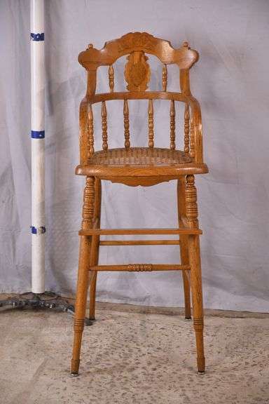 Oak Eastlake style child's high chair with caned seat; 55-11196