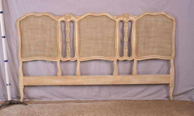 Carved off-white king size headboard with caned panels; 68-5251