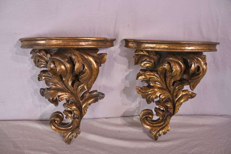 Pair of ornate dark gold wall shelves; 16752-003