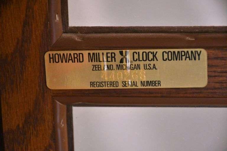 Howard Miller grandfather clock with oak case; 16748-006