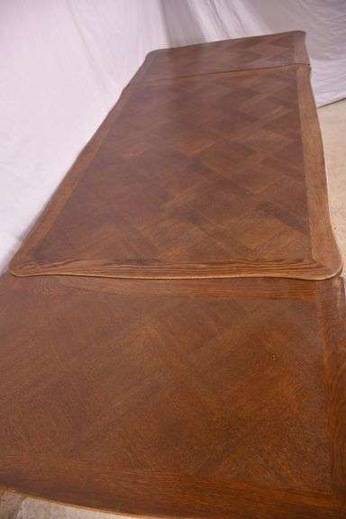 Oak French style draw-leaf dining table with parquet top; 495-328