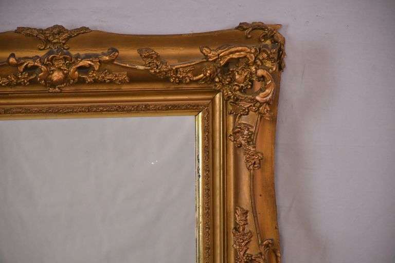 Mirror with ornate gold frame; 74-11631E