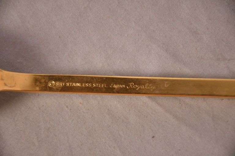 SRI "Royalty" gold toned stainless flatware set; 14-2666