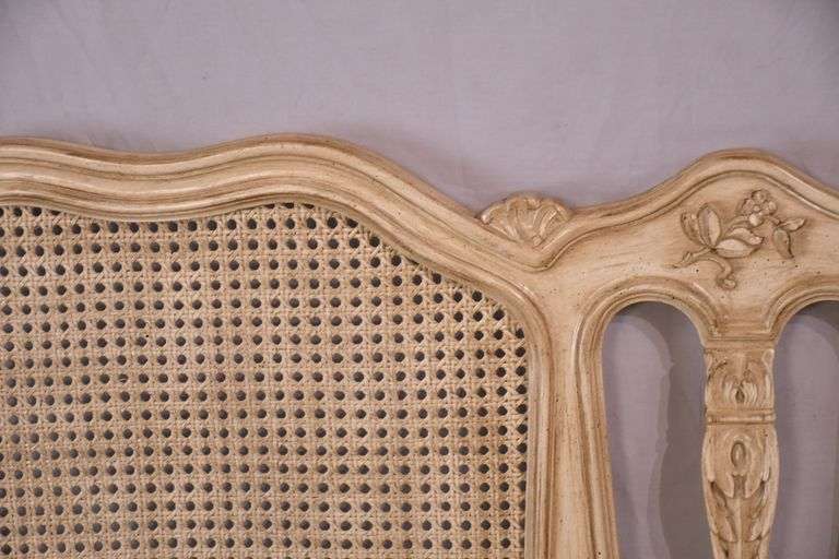 Carved off-white king size headboard with caned panels; 68-5251