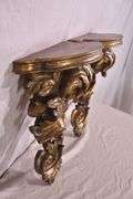 Pair of ornate dark gold wall shelves; 16752-003
