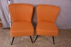Pair of mid-century style chairs with orange fabric and black metal legs; 1116-480