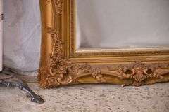 Mirror with ornate gold frame; 74-11631E