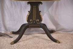 Mahogany flip-top game table with black and gold lyre pedestal base; 495-313