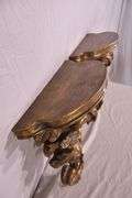 Pair of ornate dark gold wall shelves; 16752-003