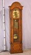 Howard Miller grandfather clock with oak case; 16748-006