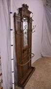 Carved walnut caned back hall tree with beveled mirror; 68-5329