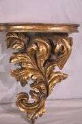 Pair of ornate dark gold wall shelves; 16752-003