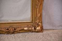 Mirror with ornate gold frame; 74-11631E
