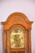 Howard Miller grandfather clock with oak case; 16748-006