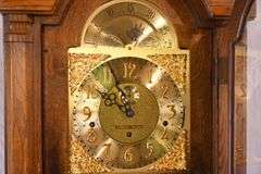 Howard Miller grandfather clock with oak case; 16748-006
