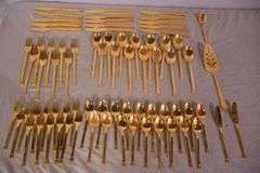 SRI "Royalty" gold toned stainless flatware set; 14-2666