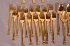 SRI "Royalty" gold toned stainless flatware set; 14-2666
