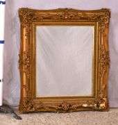 Mirror with ornate gold frame; 74-11631E