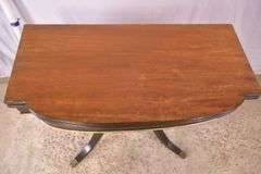Mahogany flip-top game table with black and gold lyre pedestal base; 495-313