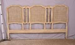 Carved off-white king size headboard with caned panels; 68-5251