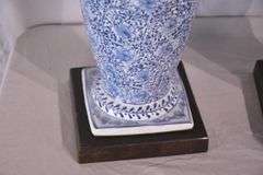 Pair of blue and white ceramic vases with bronze lion head adornments; 6117-017