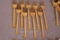 SRI "Royalty" gold toned stainless flatware set; 14-2666
