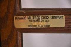 Howard Miller grandfather clock with oak case; 16748-006