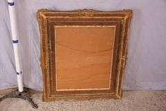 Mirror with ornate gold frame; 74-11631E