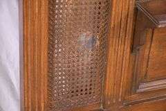 Carved walnut caned back hall tree with beveled mirror; 68-5329