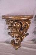 Pair of ornate dark gold wall shelves; 16752-003