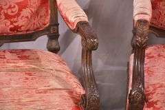 Pair of carved walnut open armchairs; 68-5084