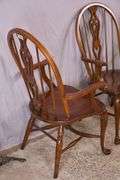 Set of 4 Pennsylvania House cherry Windsor style open arm chairs with stretcher bases; 155-825