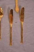 SRI "Royalty" gold toned stainless flatware set; 14-2666