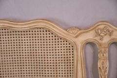 Carved off-white king size headboard with caned panels; 68-5251