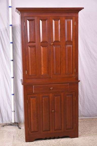 Cherry corner cabinet with raised panel doors; 662-1968