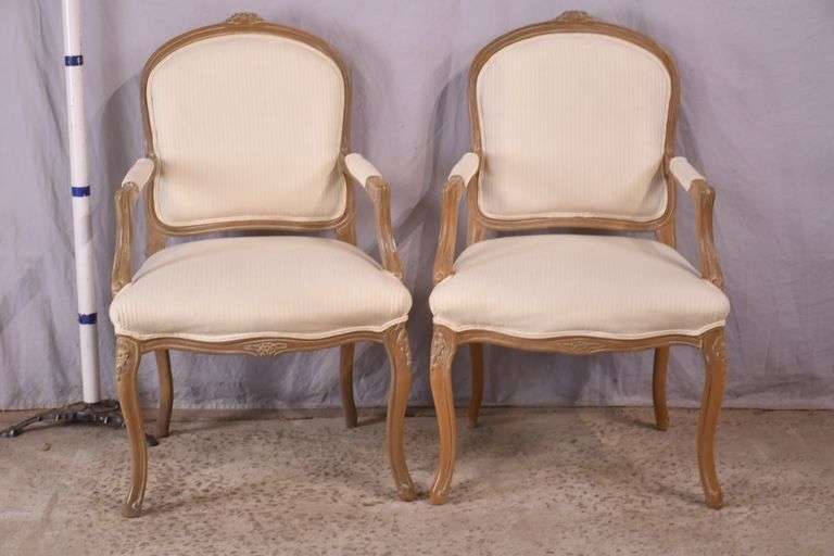 Pair of carved French style open armchairs; 336-4210