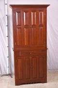 Cherry corner cabinet with raised panel doors; 662-1968