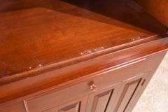 Cherry corner cabinet with raised panel doors; 662-1968