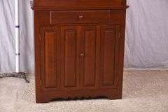 Cherry corner cabinet with raised panel doors; 662-1968