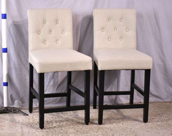 Pair of off-white linen upholstered bar chairs with tufted backs and black bases; 15102-005