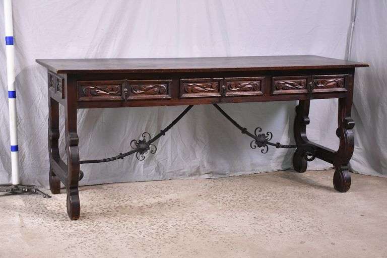 Carved Spanish style 3 drawer console/library table with ornate iron supports; 55-12431