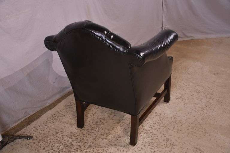 Painted black leather armchair with tufted back and seat; 336-4498
