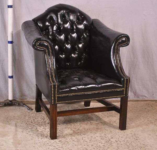Painted black leather armchair with tufted back and seat; 336-4498