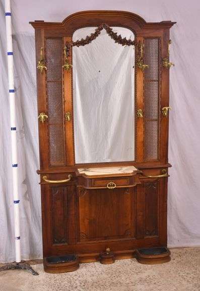 Ornate walnut beveled mirror hall tree with marble shelf and drawer; 68-6670