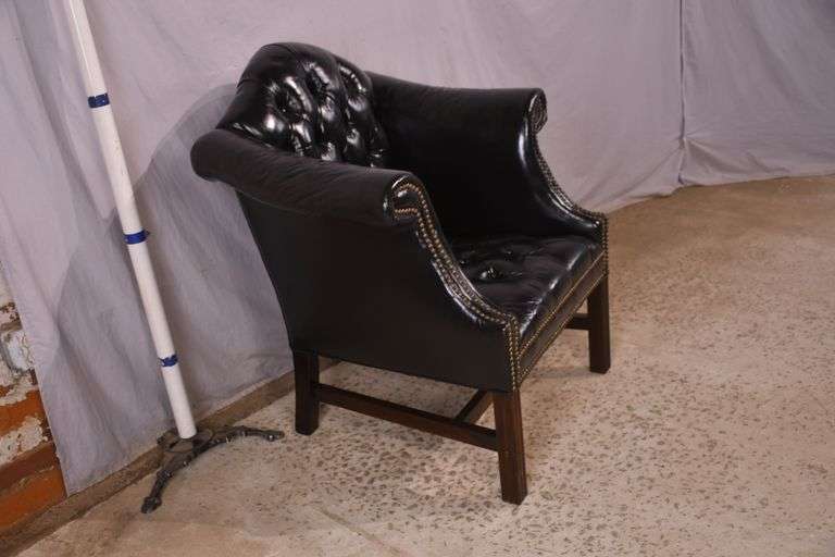 Painted black leather armchair with tufted back and seat; 336-4498