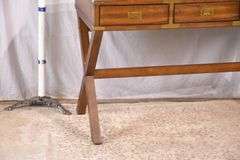 Campaign style 3 drawer writing table with trestle base; 68-6716