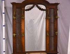 Ornate walnut beveled mirror hall tree with marble shelf and drawer; 68-6670