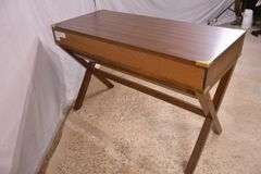 Campaign style 3 drawer writing table with trestle base; 68-6716