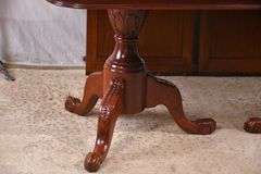 Carved mahogany double pedestal dining table with 2 skirted leaves; 68-6533A