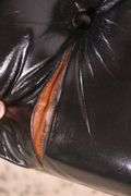 Painted black leather armchair with tufted back and seat; 336-4498